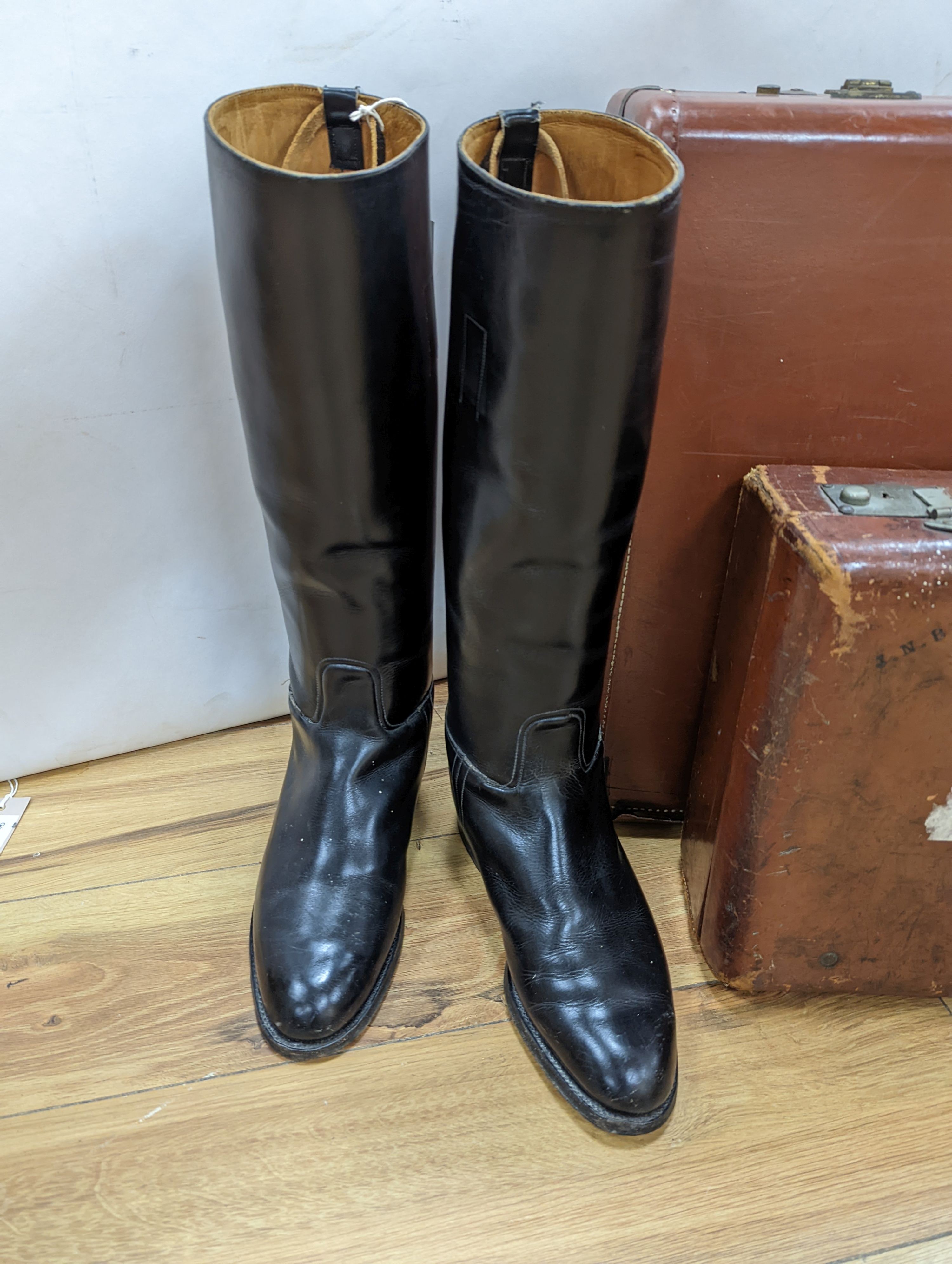 A pair of gents riding boots and 2 vintage cases, largest case, 48 cms high x 62 cms wide